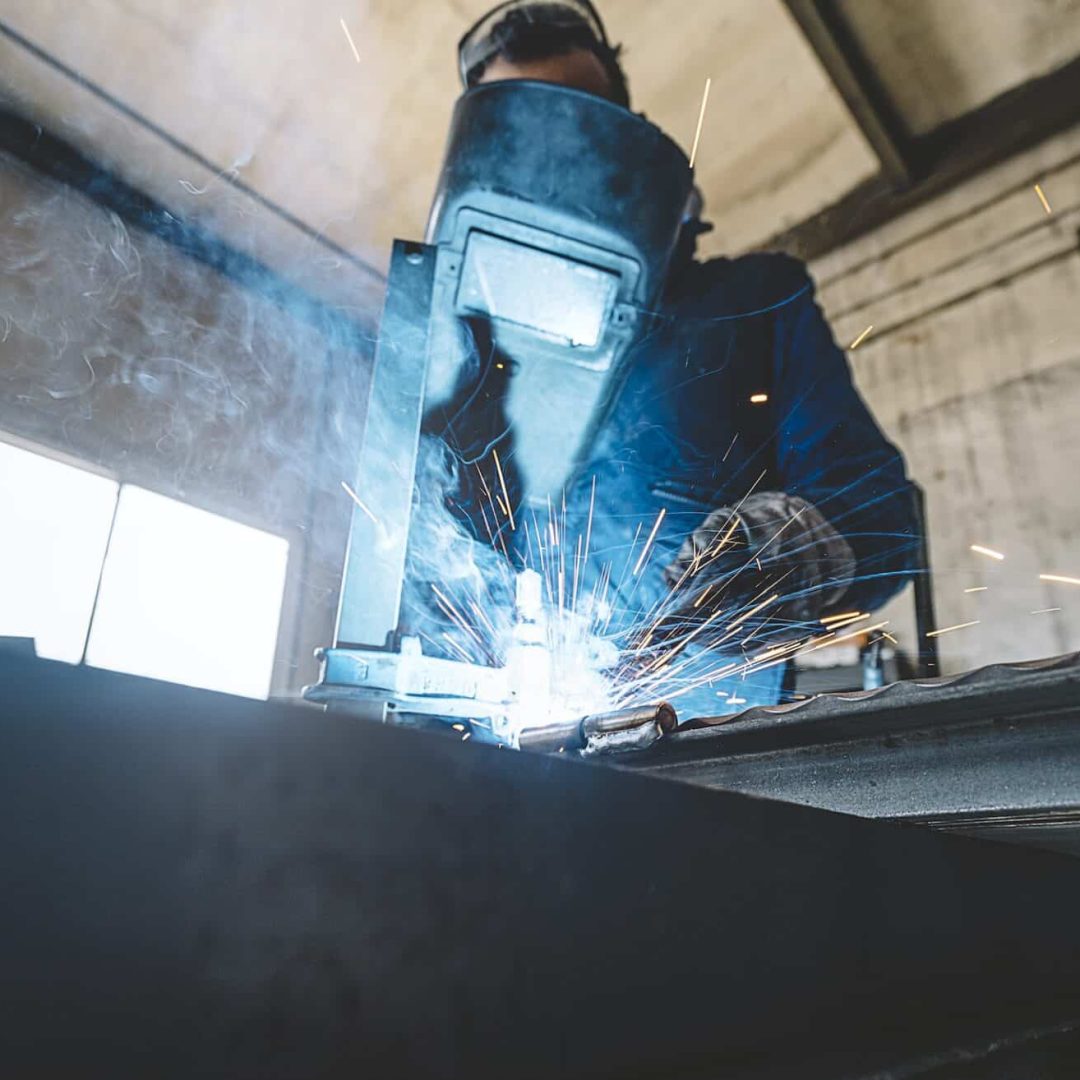 Man doing a solder in metal.
